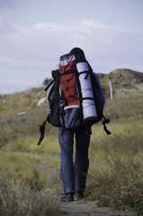 A tourist walks along the trail