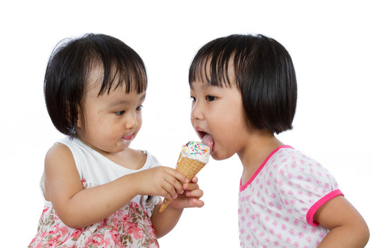 Asian Little Chinese Girls Eating Ice Cream