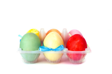A plastic box with easter eggs isolated on white background