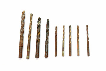 Set of steel drill bits on white background