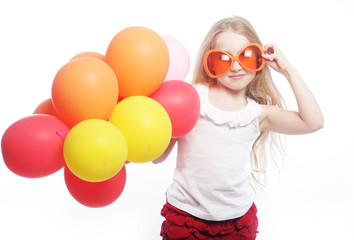girl with balloons and orange sunglasses