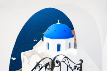 Church with blue domes in Oia town on Santorini island, Greece