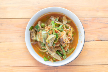 Close up spicy red curry with chicken and herbs
