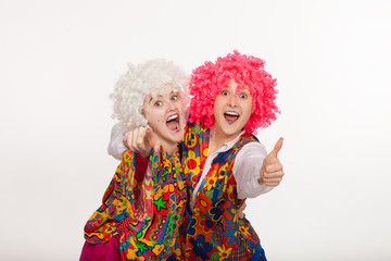 Funny Clowns in bright costumes