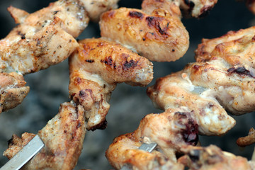 Chicken on the grill to cook