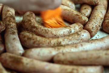 Fototapeta premium preparing sausages on fire