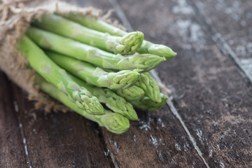 Asparagus on dark wood table