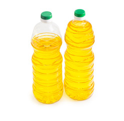 Two bottles of sunflower oil on a light background