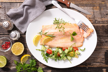 baked fish and salad