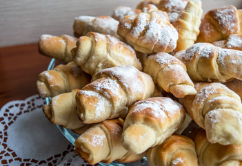 Croissants in powdered sugar