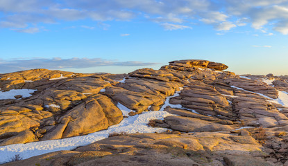 Sunset in the granite eroded mountains Bektau-Ata