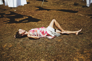 portrait of a girl in a field with a fan