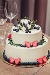 wedding cake with strawberry and blueberry at reception