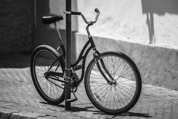 Fototapeta na wymiar Black Bicycle Parking On Street In European City. Black And Whit