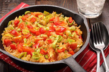 Rice with vegetables baked in a pan