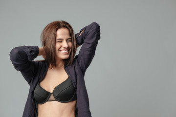 Smiling woman in bra - Powered by Adobe