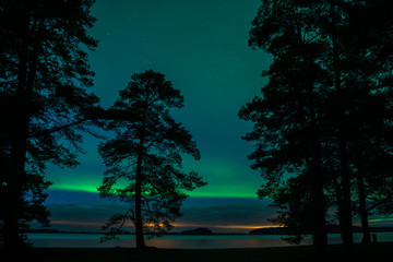 Northern lights over lake landscape