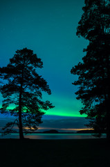 Northern lights over lake landscape