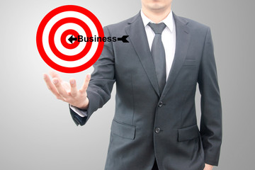 Businessman hold goals to the target business concept