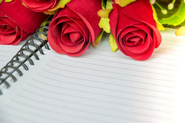 The roses with blank notebook , digital effect abstract for background