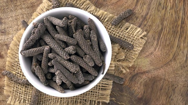 Rotating Long Pepper as not loopable 4KUHD footage