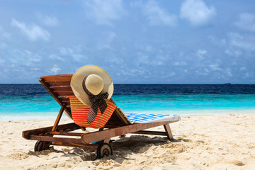 Fototapeta na wymiar Beach chair on perfect tropical beach