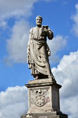 Saint Peter statue with key, book and papal coat of arms from Sant'Angelo monumental bridge, in the center of Rome