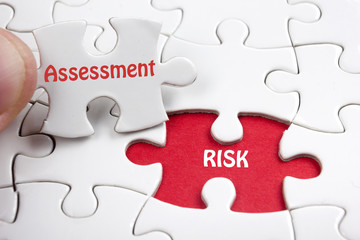 Risk Assessment. Missing jigsaw puzzle pieces with text. - 106196767