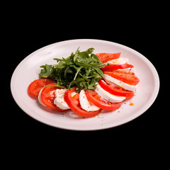 Caprese salad on black