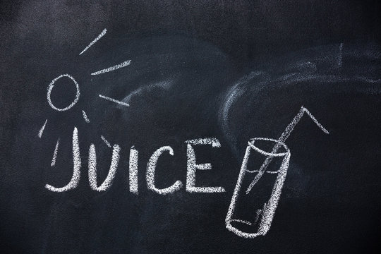 Juice and sun drawn on blackboard