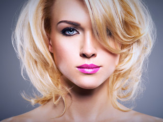 Portrait of  beautiful woman with blond hair.  bright fashion m