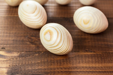 Beautiful wooden Easter eggs on a background of old brown boards with free space for your text