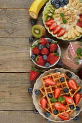 Fototapeta na wymiar Waffles with berries and caramel sauce