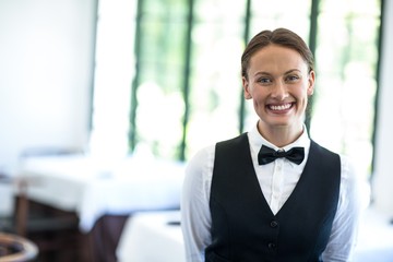 Happy waitress smiling at camera