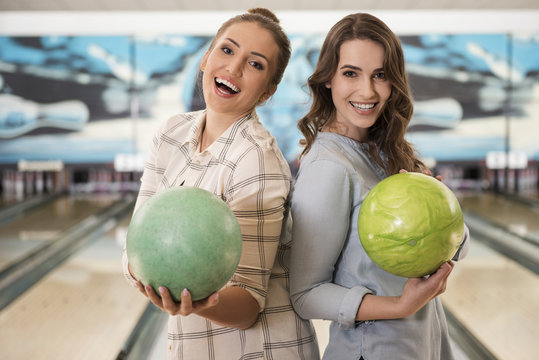 Female best friends in bowling club
