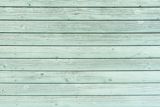 Section of pale green wood panelling from a seaside beach hut. Could be used as a background to illustrate beach and summer holiday themes. Also garden themes.

