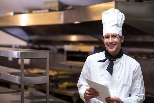 Handsome Chef Holding Menu