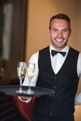 Waiter smiling at camera