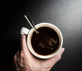 Holding Coffee Cup in Hand