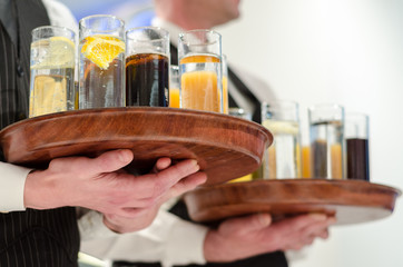 Waiter offers juice and drink at the opening ceremony
