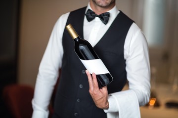 Waiter presenting red wine