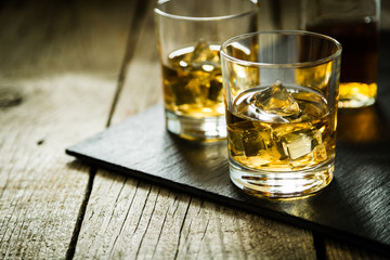 Whiskey with ice in glasses
