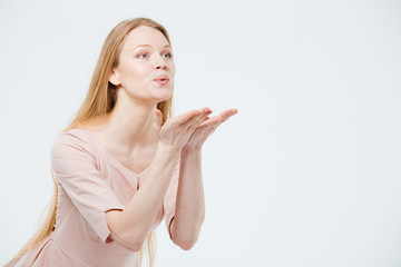 Young woman blowing kiss