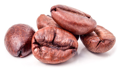 Several coffee grains on white background