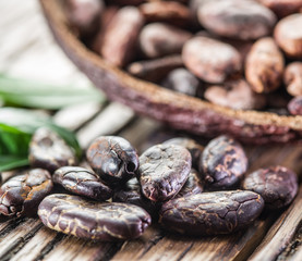 Cocoa pod and Cocoa beans on the wooden table.