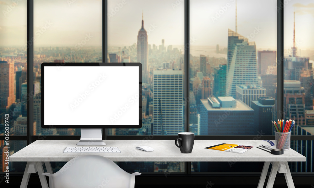 Poster Isolated computer display for mockup in office interior overlooking the city and skyscrapers. Work desk with keyboard, mouse, cup of coffee, paper, pencils.