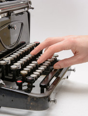 hand typing with old typewriter