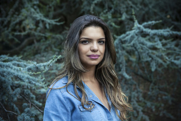 Portrait of a young girl smiling with nature background