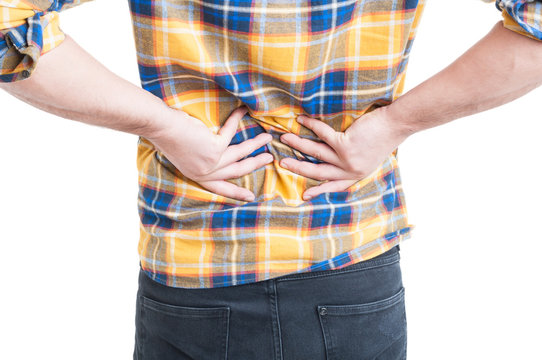 Young man grab his back because lombar pain