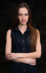beautiful young woman. Black background.